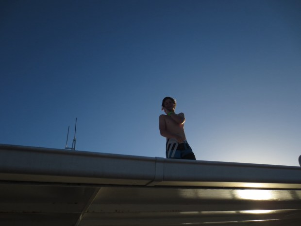Jacob jumping from the roof of the boat