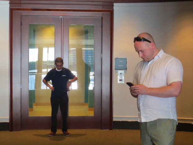 The Ever Elusive Accenture Miami Office in it's natural habitat. Employee (Accenturis Employensis) seen standing outside, worshipping. Cleaner keeping guard.