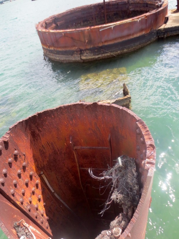 Some of the Arizona sticks up from the water. That's how shallow this harbour is...